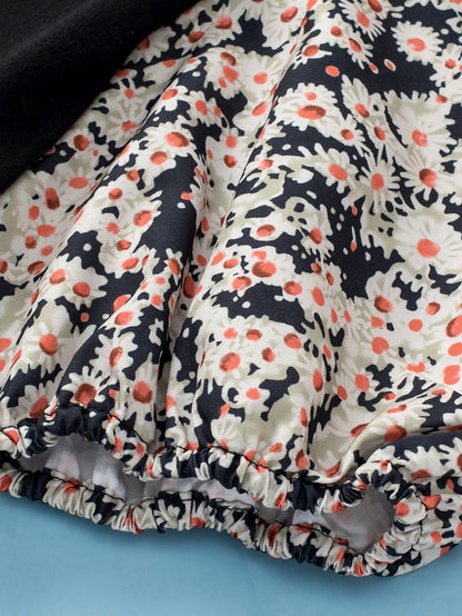 Elegant Black Daisy Bubble Sleeve Plus Size Floral Tunic Top